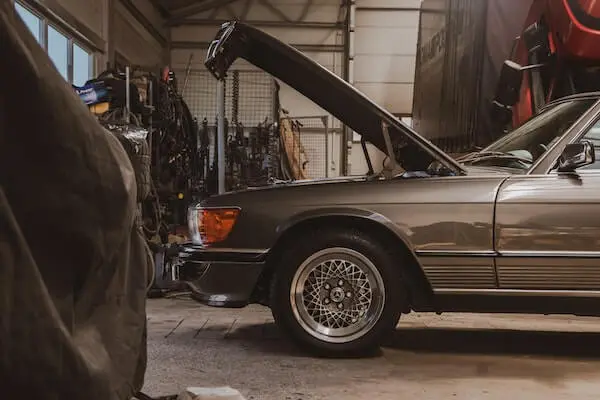 A gray vehicle parked in a garage