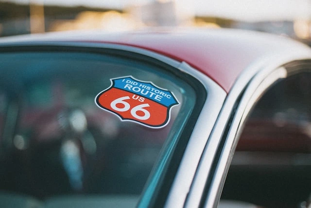 A Route 66 sticker on a car window
