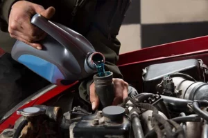 man adding a coolant