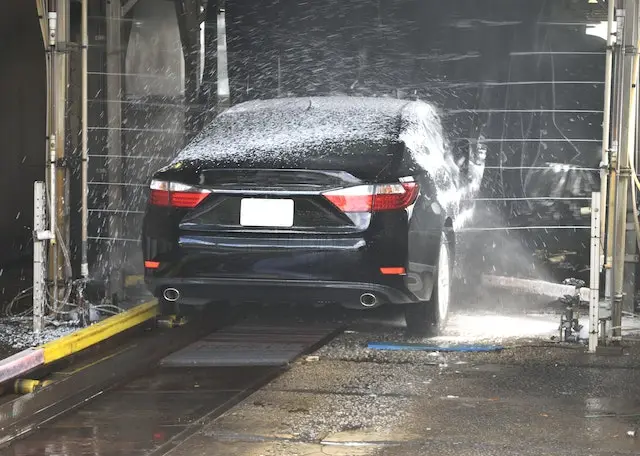 A-black-car-getting-washed-at-a-car-wash