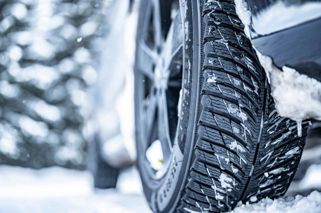 A-close-up-of-a-car-tire-in-snowy-weather