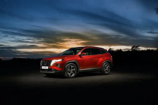 A-red-Hyundai-Tucson-in-sunset car