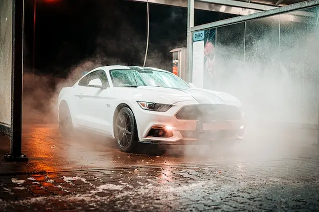 A-white-coupe-Mustang-at-a-car-wash-service