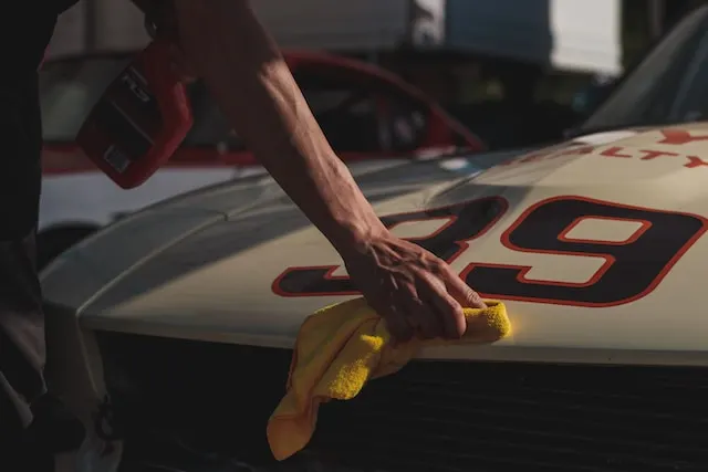 Man-wiping-a-sports-car