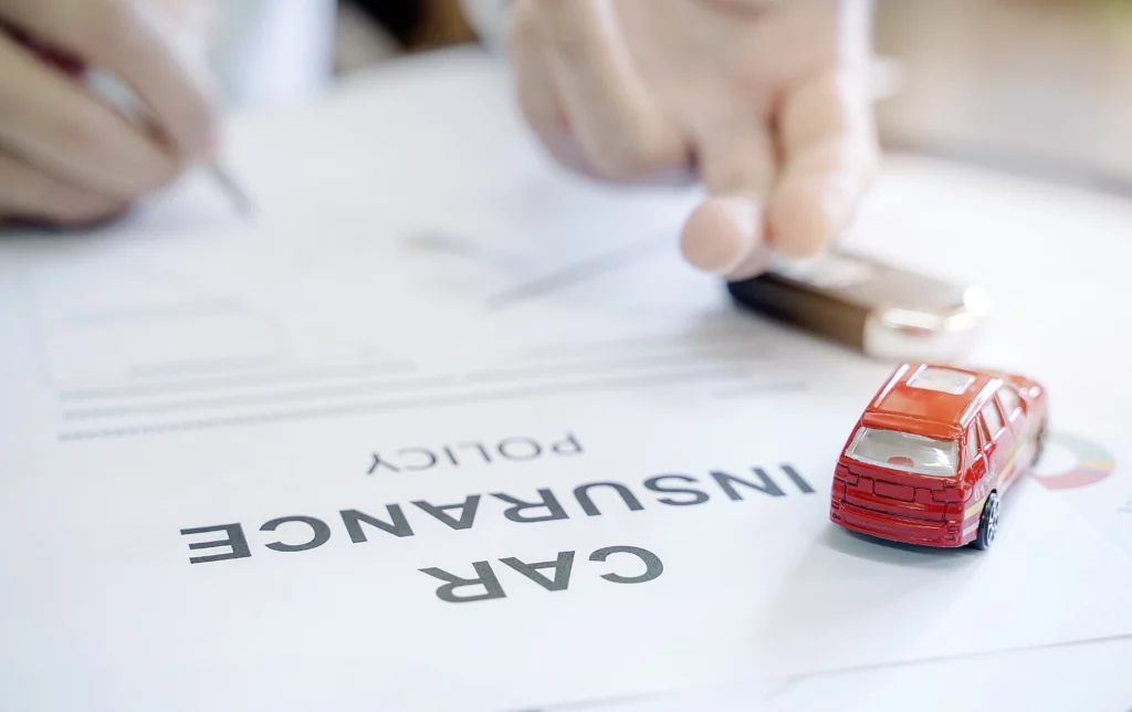 Person signing a car insurance policy