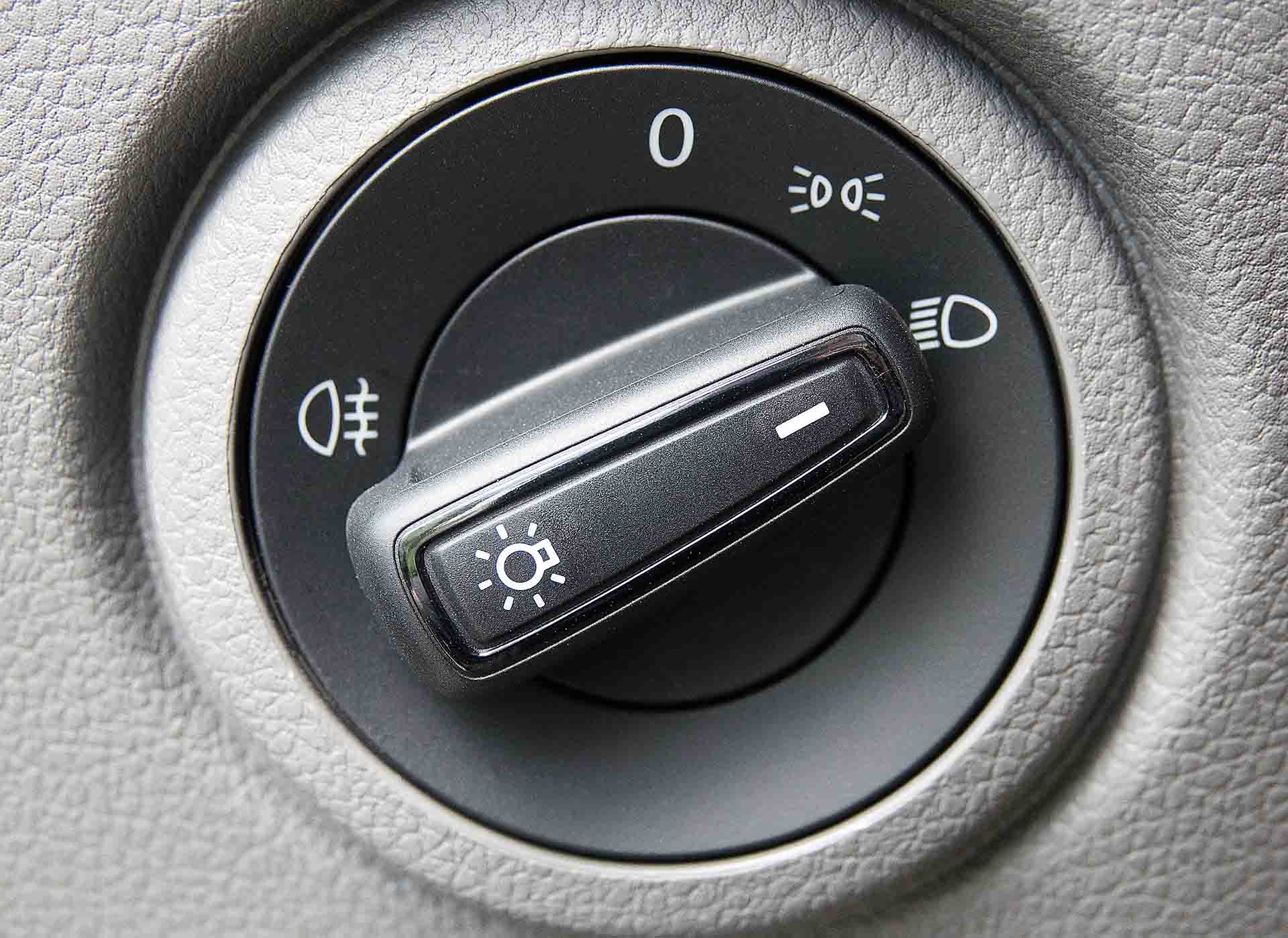 A close-up of a headlight switch dial