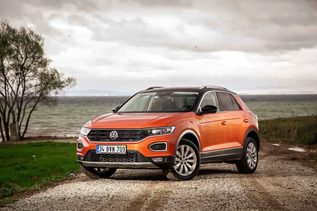 An orange Volkswagen T-Roc car parked