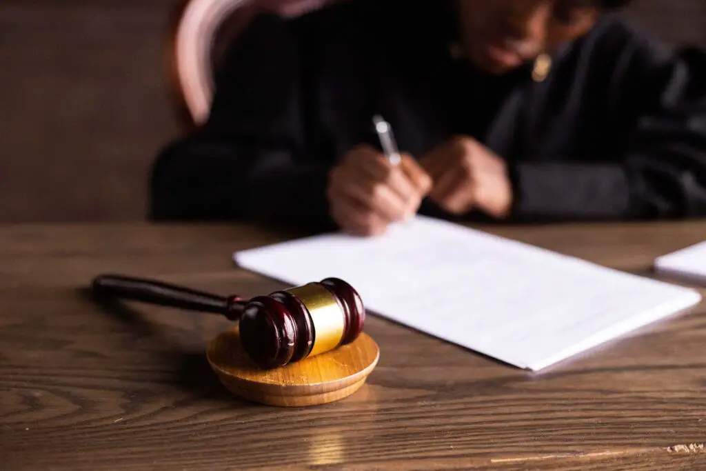 A judge signing the papers