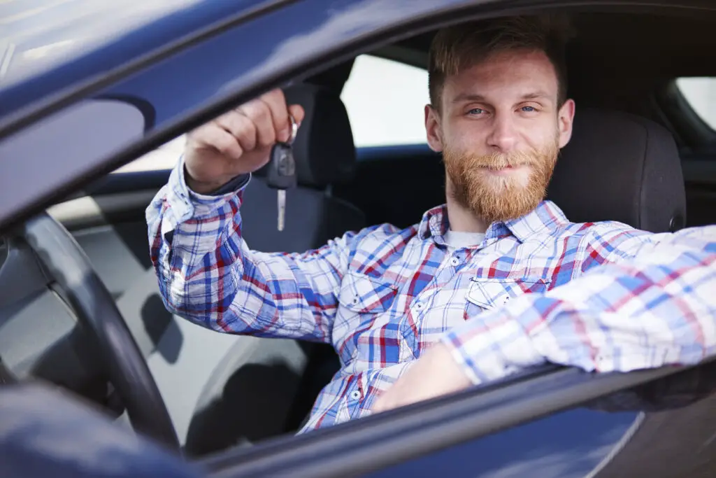 A man holding car keys