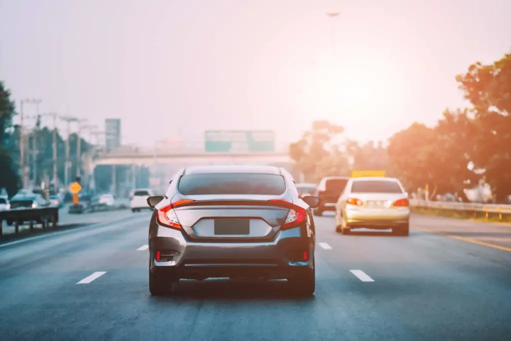 Car Driving on road and Small passenger car seat on the road used for daily trips