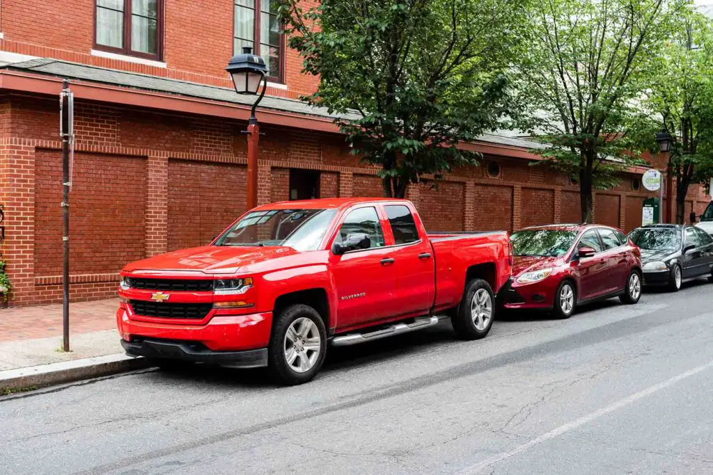 Philadelphia, Pennsylvania, USA - June 17, 2019: red Chevrolet truck pickup parked on the side of the street in Philadelphia