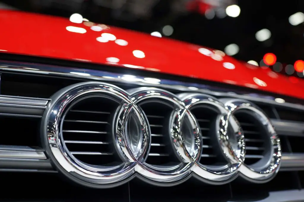 The emblem on the front grille of Audi car