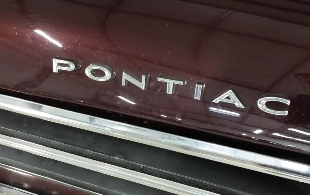 Pontiac logo brand and american sign text on vintage us car