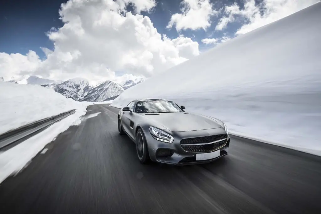 A low rider car on a snowy road