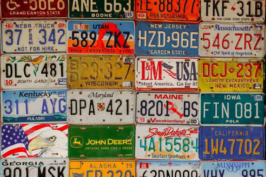Different license plates on a wall