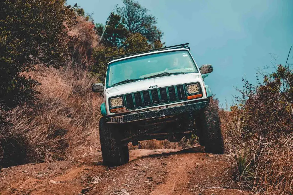 Jeep Cherokee XJ car cruising down the road