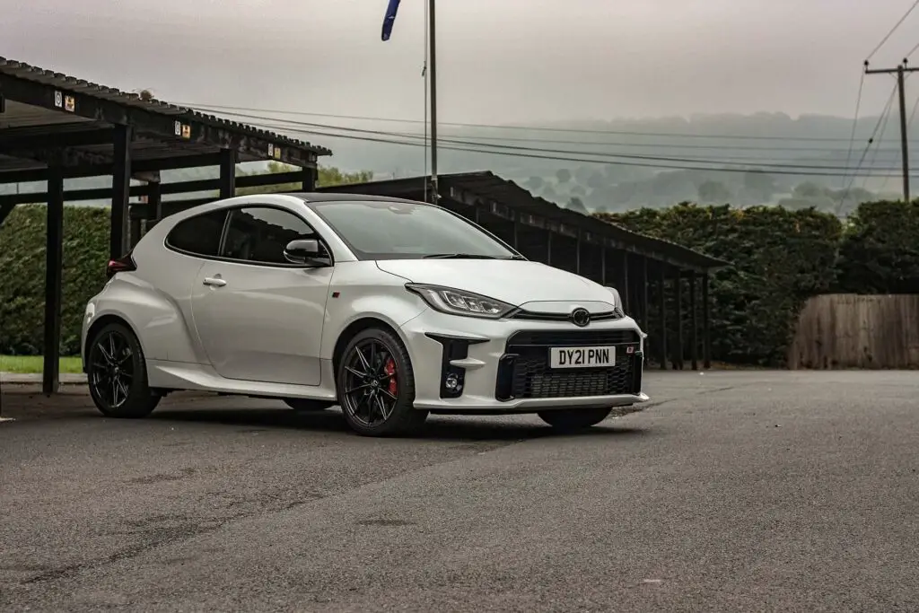 White Toyota Yaris parked outside