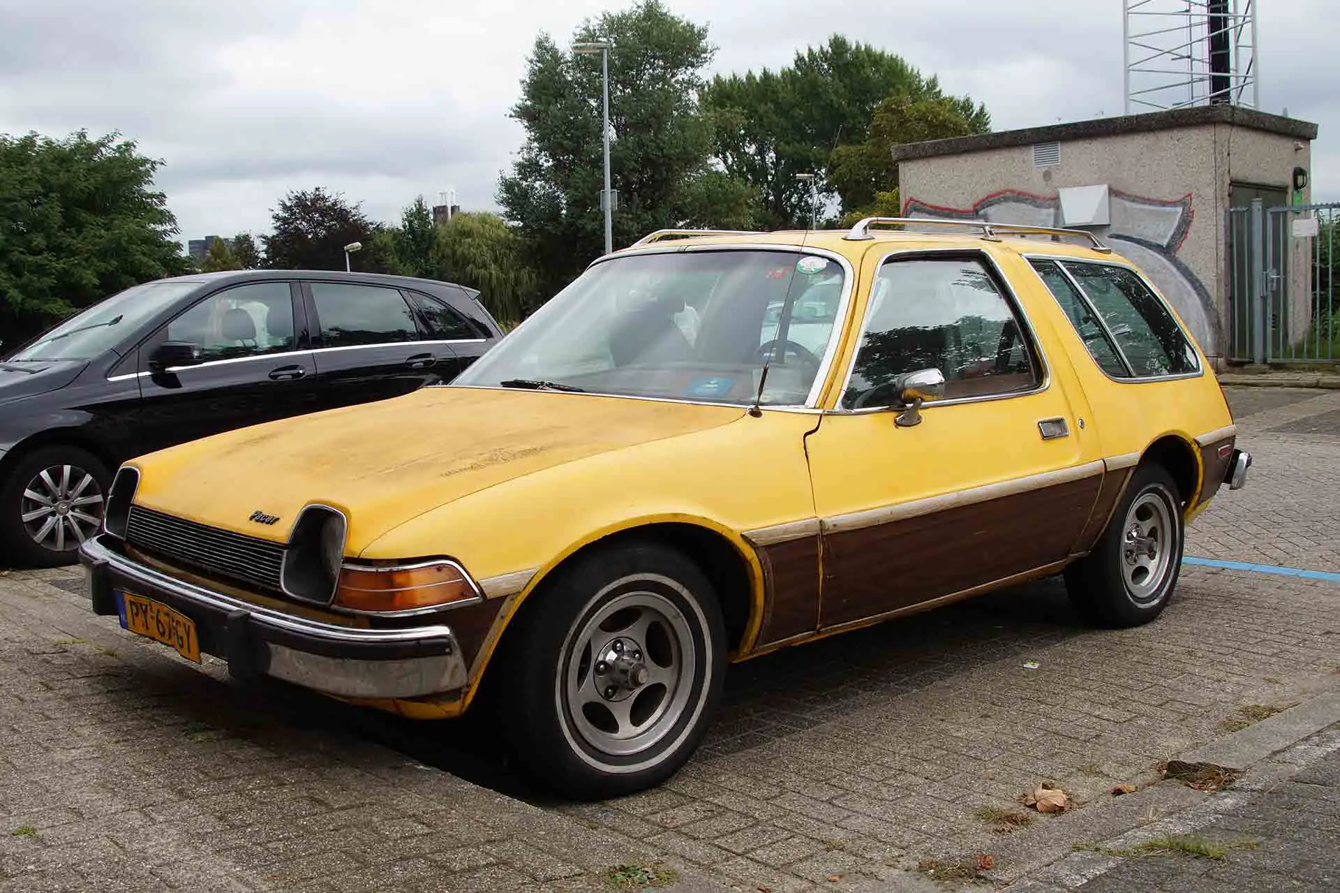 Yellow AMC Pacer parked