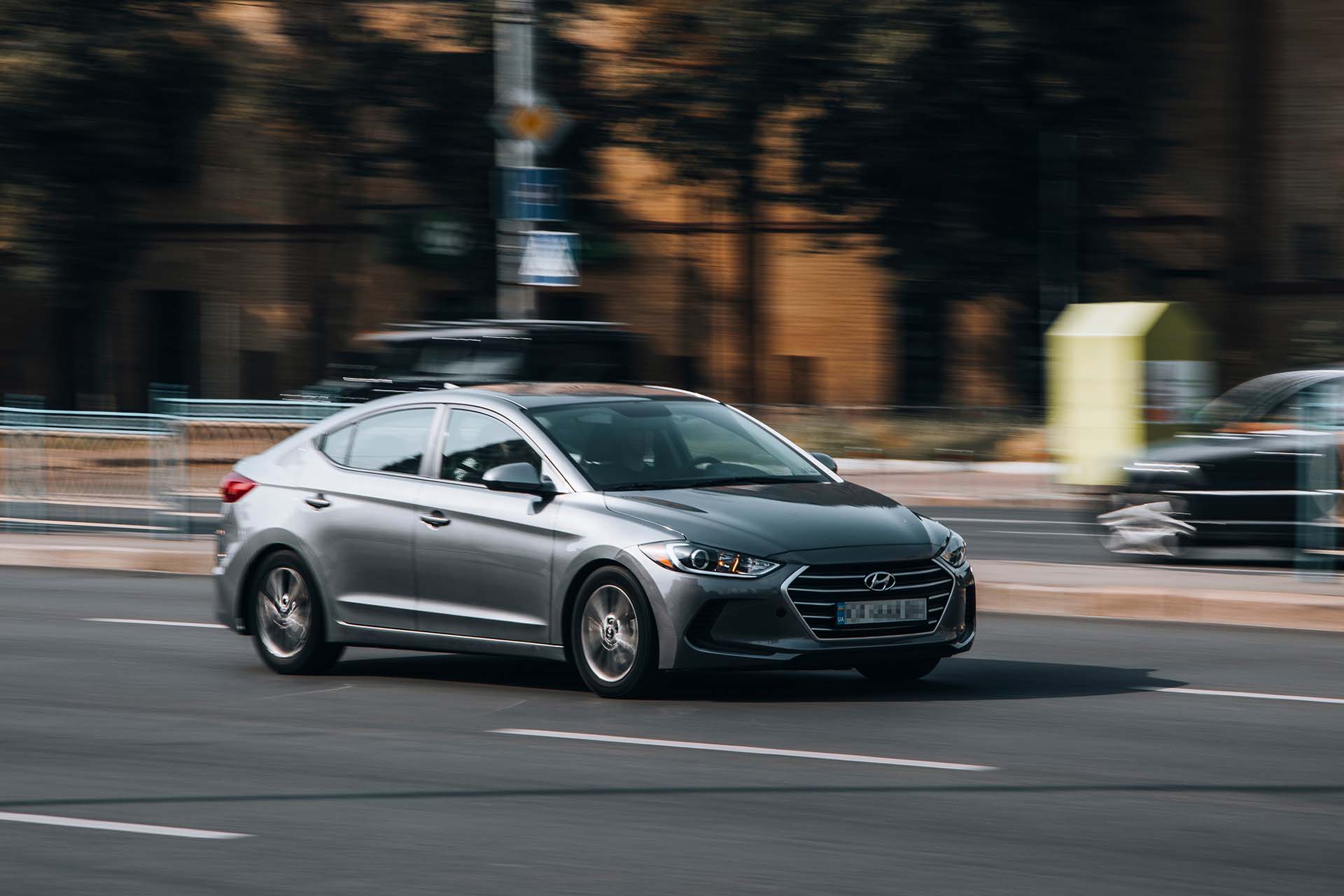 Silver Hyundai Elantra car moving on the street. Editorial