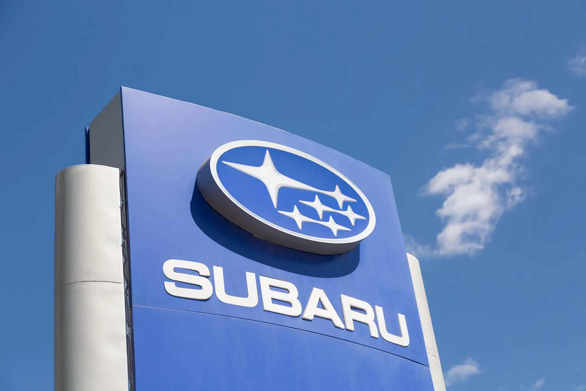 Subaru automobile dealership Sign against blue sky. Subaru is a japanese manufacturer of automobiles