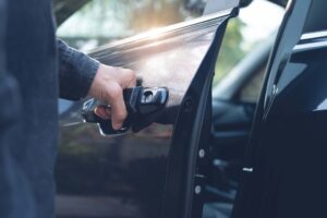 Close up of a male hand opening a car door