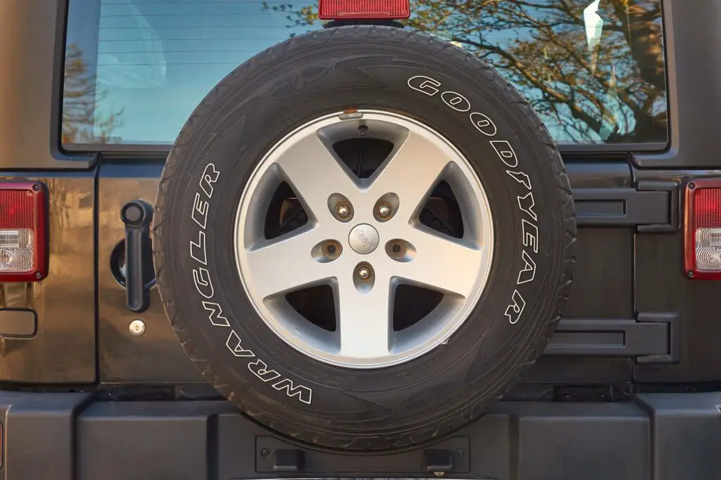  Spare wheel on the back of a Jeep Wrangler 4x4 off-road vehicle, Goodyear tyre