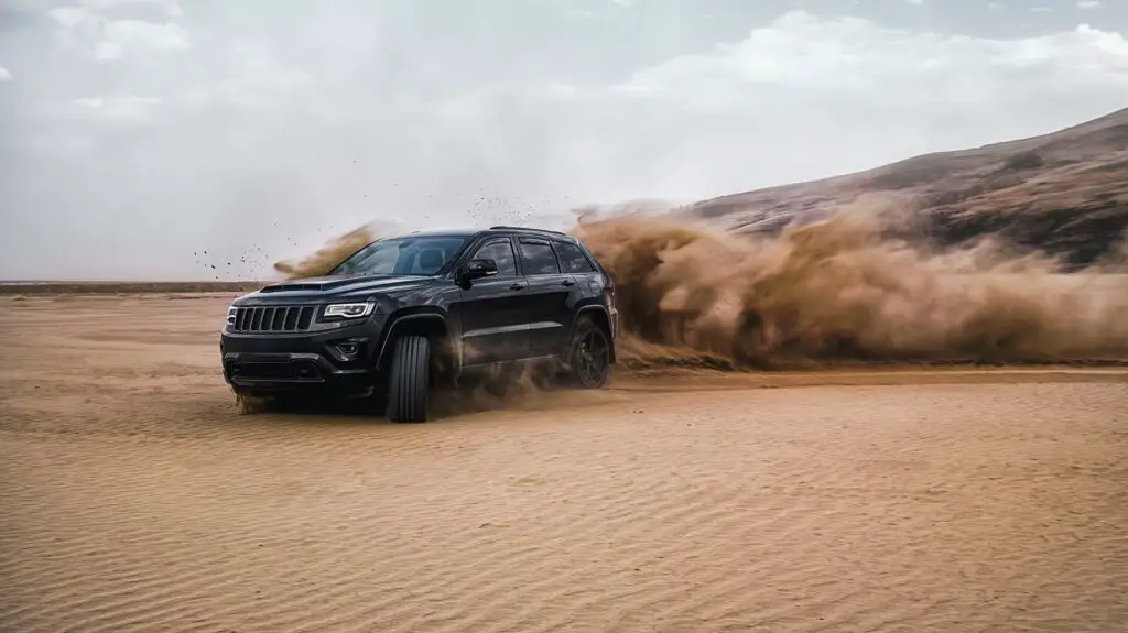 Jeep Grand Cherokee on a sandy beach