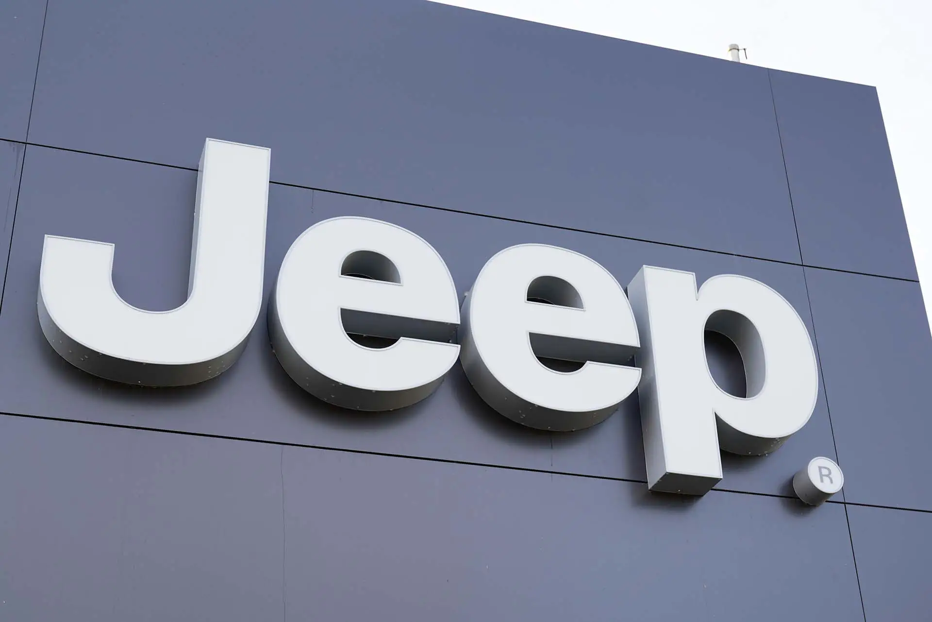 Jeep logo dealership sign car store part Fiat Chrysler Automobiles shop sport utility vehicles suv and off-road