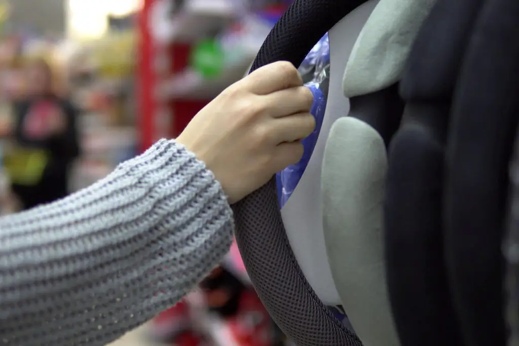 A person holding a steering wheel