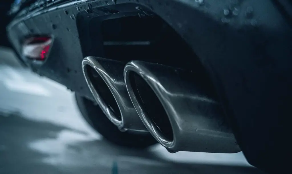 An exhaust pipe on a black car