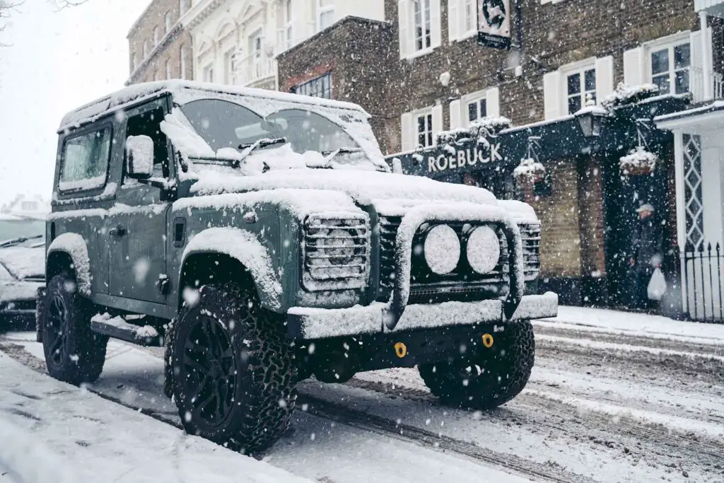 Classic Land Rover Defender on the snowy Streets of West London
