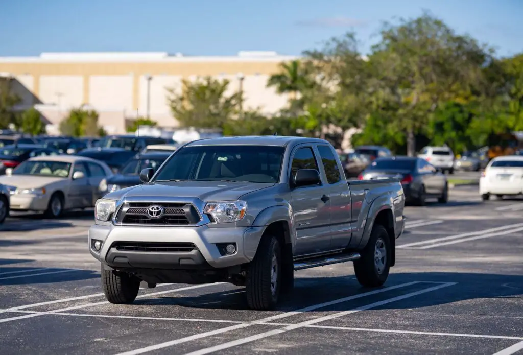 Photo of a Toyota Tacoma pick up truck in a parking lot