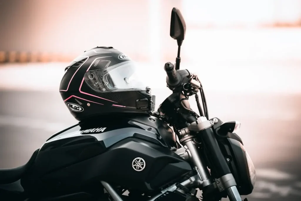 A black Yamaha motorcycle with a helmet on top