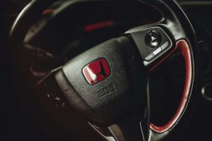 A steering wheel in a Honda car
