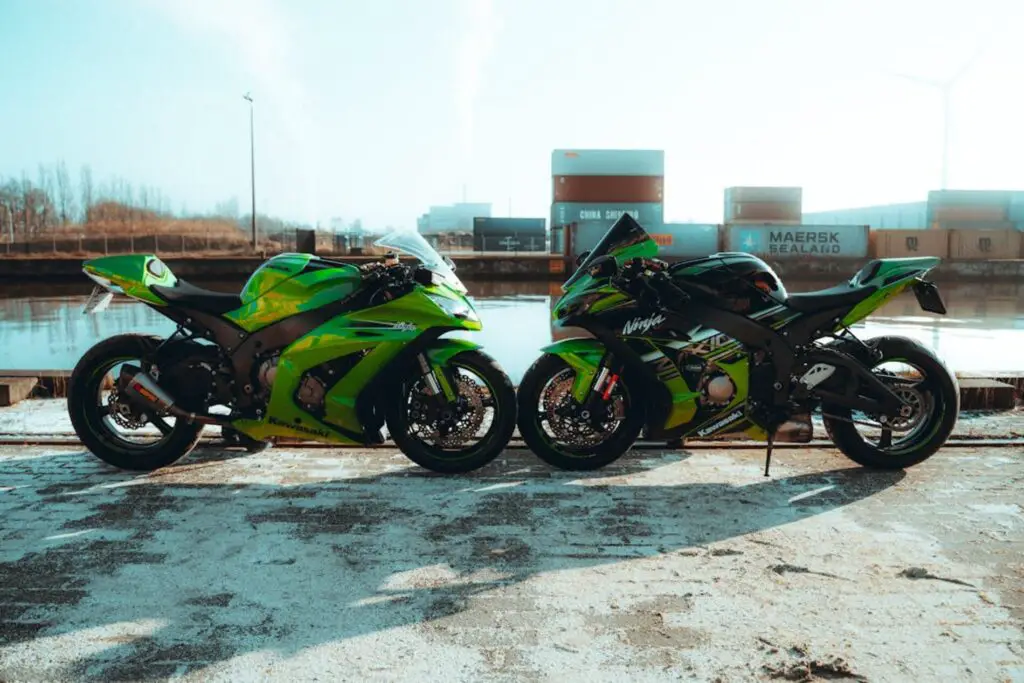 Two green Kawasaki Ninja motorcycles
