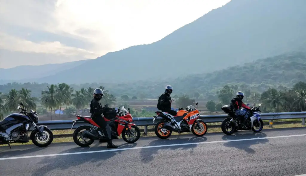 A group of people with their pick of low-maintenance motorcycle