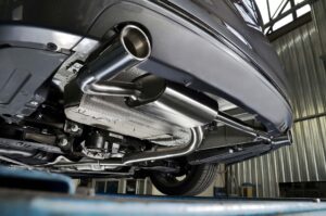 Exhaust tailpipe and muffler on the car bumper