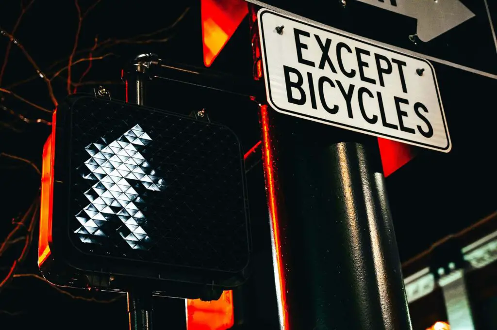  Except bicycles sign at night 