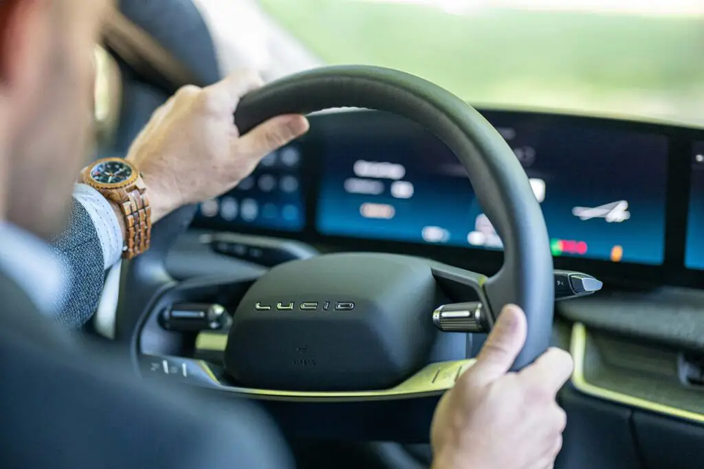 A man driving Lucid Air electric car