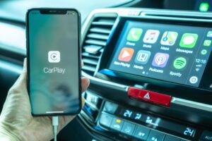 Apple CarPlay app on iPhone X, smart mobile application connected to Honda car for travel map, hand free phone call, online music on transportation vehicle safety