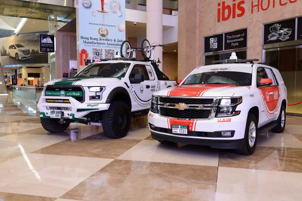 The Ford Raptor of Dubai Police and Chevrolet Tahoe rescue cars are on Dubai Motor Show