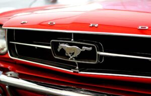 A Mustang emblem on a red car