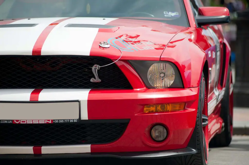 A red and White Ford Mustang Shelby