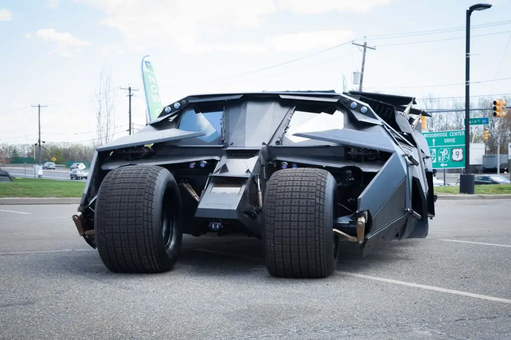 replica of the Batmobile Tumbler from The Dark Knight is shown at a local car show.