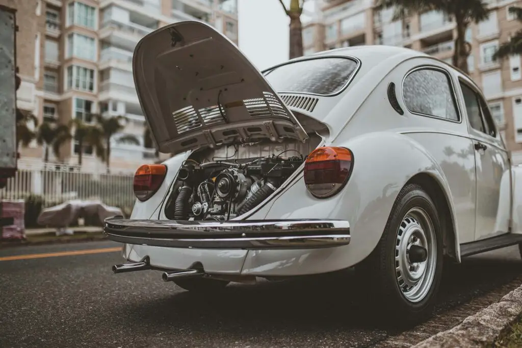 An open trunk of the Volkswagen Beetle showing the engine