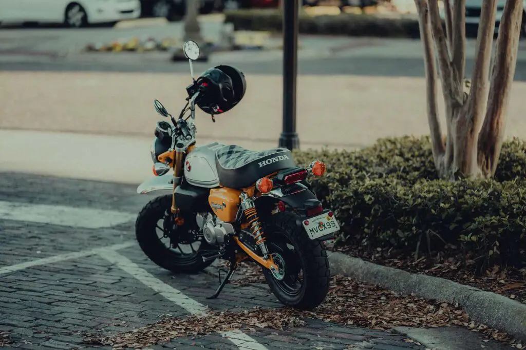 A Honda motorbike parked on the street