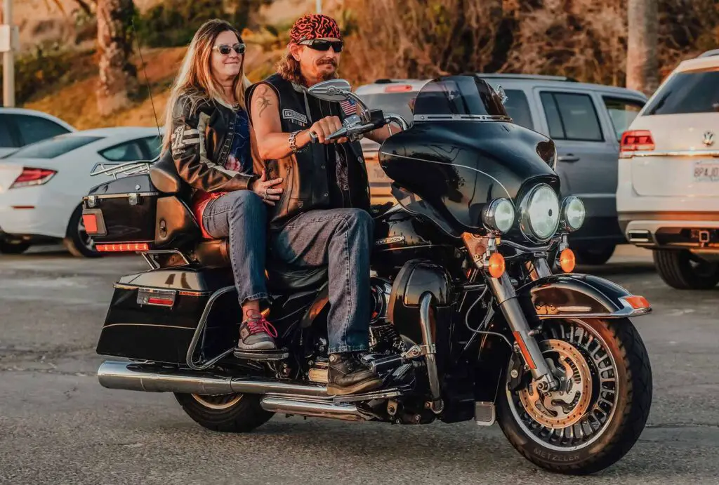 A couple riding on a Harley