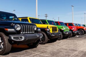 Jeep Wranglers on display at a Chrysler Jeep dealership. The subsidiaries of FCA are Chrysler, Dodge, Jeep, and Ram IV