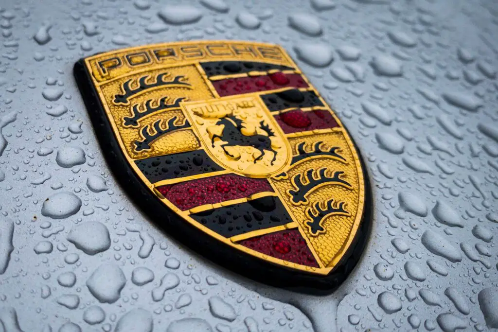 Porsche Logo Badge Crest Hood Ornament Closeup in the Rain 
