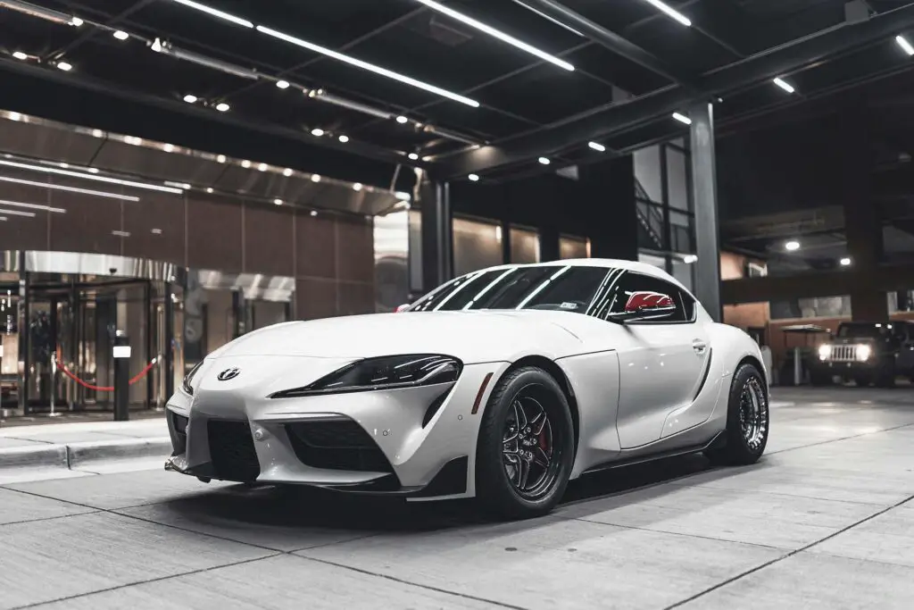 Supra Parked In Front Of Building
